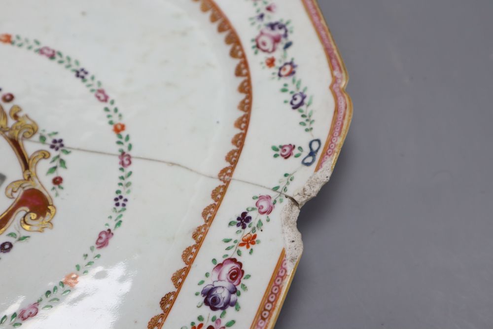 A Chinese two handled cup, height 14cm, a Qianlong blue and white dish and an armorial dish